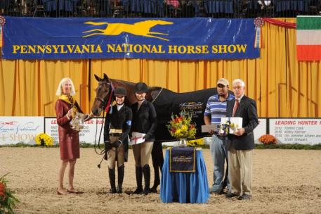Dr. Betsee Parker presents the Championship to Kahlua and Emma Kurtz.