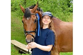 Skylands Saddlery’s Custom Saddlery saddle fitter Kara Somerville with Psymbad VF (Photo courtesy of Lorri Ackerman) 