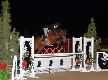 Kelley Farmer and Dalliance on their way to a 00,000 USHJA International Hunter Derby win at National Sunshine Series II in Thermal, CA. 