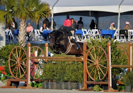 Kelley Farmer and Mindful on their way to a 00,000 USHJA International Hunter Derby win. 