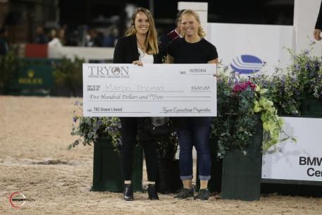 Margo Thomas accepts the Grooms' Initiative Award with Charly Miller of TIEC.
