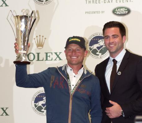 Michael Jung was pleased to receive a replica of the Rolex Grand Slam of Eventing trophy he won in 2016 from Rolex Watch USA's Kyle Younghans. 