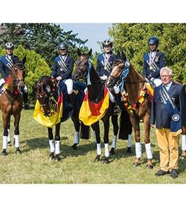 Germany’s Hanna Knuppel, Romina Engelberth, Lara Schapmann and Johanna Zantop pictured with Chef d’Equipe Heinz Nothofer after winning the FEI European Eventing Championships for Juniors 2015 at Bialy Bor in Poland. Zantop also claimed the individual title. (FEI/Hanna Broms/EventingPhoto.com)