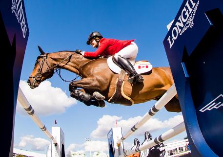 Team Canada’s Tiffany Foster and Brighton in full flight at the Longines FEI Jumping Nations Cup™ of the United States of America 2018 in Ocala (USA) today where Canada claimed a clear-cut victory. (FEI/Shannon Brinkman)