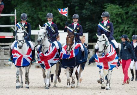 Happy days! The British Eventing team of Ellie Healy, Hattie Grace, Saffron Osborne and Daisy Proctor celebrate after winning gold at the FEI European Pony Championships 2018 at Bishop Burton College in Yorkshire (GBR) yesterday. (FEI/Adam Fanthorpe)