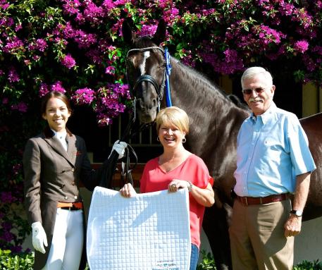 Chase Hickok and Sagacious HF dominate the Under 25 division, sponsored by Diamante Farms, at the 2015 AGDF. From L-R, with Sagacious HF: Chase Hickok, Terri Kane of Diamante Farms, and Sagacious HF’s owner Al Guden