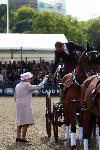 HRH Queen Elizabeth congratulates Chester Weber on another four-in-hand win at the Royal Windsor Horse Show (Photo: Risto Aaltonen)
