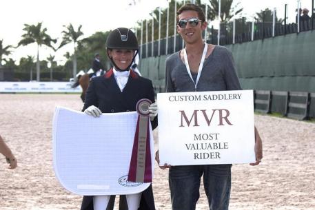 Kasey Perry (left) wins the Custom Saddelry Most Valuable Rider Award at the 2015 Adequan Global Dressage Festival.