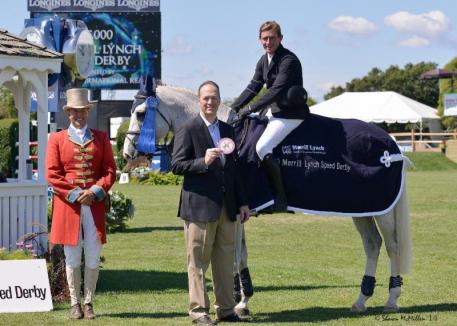 Dave Hogan of Merrill Lynch presented the top awards to Darragh Kenny on Gatsby following the 5,000 Merrill Lynch Speed Derby at the Hampton Classic. (Shawn McMillen photo) 