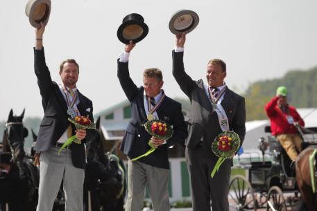 The individual Driving medallists in the Alltech FEI World Equestrian Games™ 2014 in Normandy. Pictured from left to right are silver medallist Chester Weber (USA); gold medallist and world champion Boyd Exell (AUS); bronze medallist Theo Timmerman (NED). (Marie de Ronde-Oudemans/FEI)
