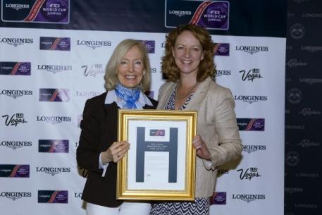 FEI Director of Press Relations Grania Willis presents Jo Peck, press officer for the London International Horse Show, Olympia, with the Best Press Office award for the Longines FEI World Cup™ Jumping Western European League 2014/2015 at the Longines FEI World Cup™ Jumping Final in Las Vegas (NV). (Photo: Dirk Caremans/FEI)