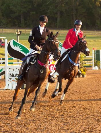 Student and Coach Laine Ashker and Buck Davidson celebrated side-by-side in the Vicory Gallop of the $40,000 Adequan USEA Gold Cup Final this afternoon at the Texas Rose Horse Park. Defending Champion Ashker finished runner-up this year after lowering just one rail in the stadium jumping phase this afternoon. Michelle Dunn photo
