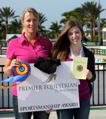 Karen Pavicic (left) accepts the Premier Equestrian Sportsmanship Award from April Leonard at the 2015 Adequan Global Dressage Festival 