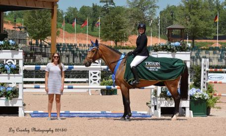 Kira Kerkorian and Nightfire 25 in their presentation ceremony with Sponsorship Manager Samantha Halperin (Photo: ©LizCrawleyPhotography)