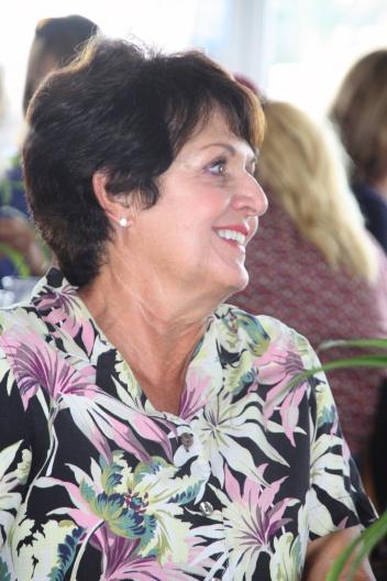 Kay Moss, winner of the TheraPlate Grand Finale Door Prize during the 2015 Winter Equestrian Festival Lunch and Learn series, watches the “Sound Year Round” presentation sponsored by TheraPlate Revolution