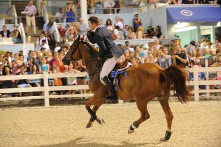 McLain Ward and Rothchild on their victory gallop following their win in the 2013 Grand Prix of Devon-photo by The Book LLC
