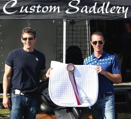 Cary Wallace (left) of Custom Saddlery presents Justin Hardin with the Custom MVR Award at the WEF Dressage Classic CDI-3*