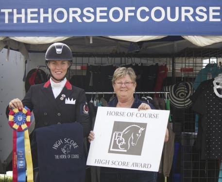 Karen Pavicic (left) is presented with The Horse of Course High Score