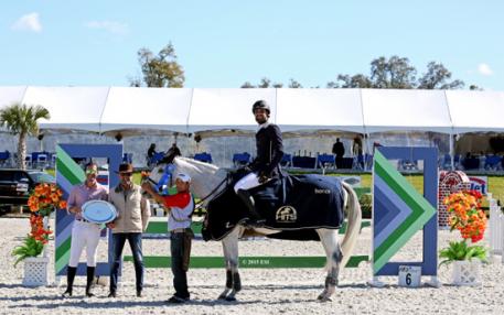 Ricardo Nizri and Carvschka receive the blue ribbon at the HITS Ocala $7,500 U-Dump/SJHOF Junior/Amateur-Owner Jumper High. (C) ESI Photography