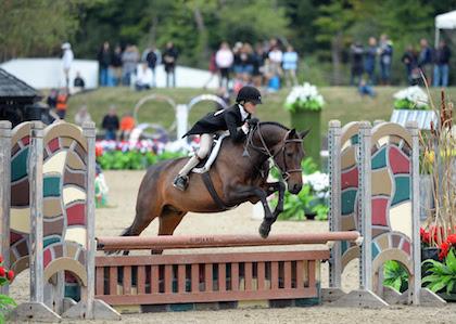 Sophee Steckbeck and Romeo in classic form during the HITS Children's Working Hunter Pony--Large division at the Marshall & Sterling Insurance Finals. ©ESI Photography 