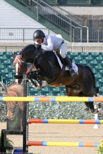 Todd Minikus and Con Capilot won the 1.45m Open Jumpers on the first day of the Kentucky Spring Horse Show. 