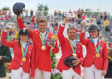 USA’s Marilyn Little, Boyd Martin, Phillip Dutton and Lauren Kieffer celebrate team Jumping gold at the Pan-American Games in Caledon Park, Toronto, Canada today. (Photo: Diana DeRosa)