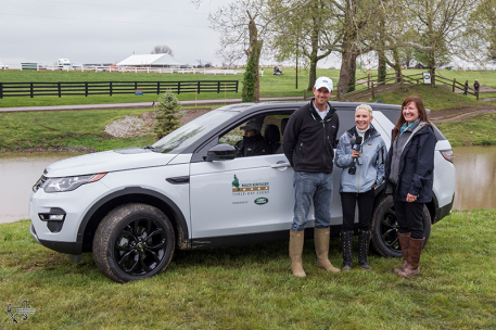 Will Coleman (left) won the Land Rover Best Ride of the Day Award, presented by Kim McCullough, vice president of marketing for Jaguar Land Rover North America (right). Television personality Donna Brothers hosted the presentation. (Photo: Ben Radvanyi)