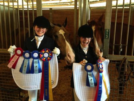 Dressage4Kids competitors with their winning ribbons and Custom saddlepads